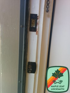 A proper strike installed with a pocket strike behind a regular strike plate. Three 3" screws secure the strike plate to the stud behind the door frame, making it much more difficult to kick the door in.